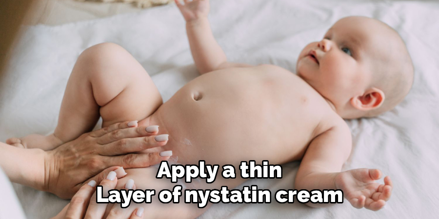 Apply a thin layer of nystatin cream